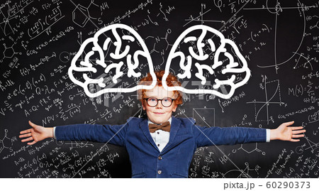 Happy kid embracing on blackboard background 60290373