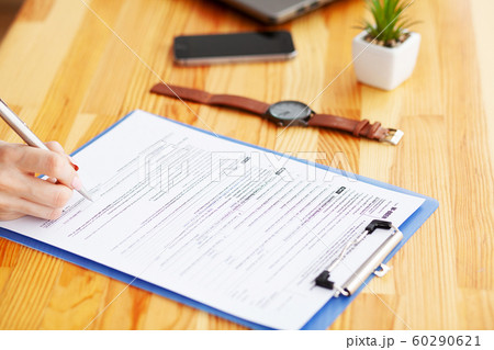Financial Manager Sitting in Desk and Work With Financial Documents Company Financial Manager Sitting in Desk and Work With Financial Documents Company 60290621