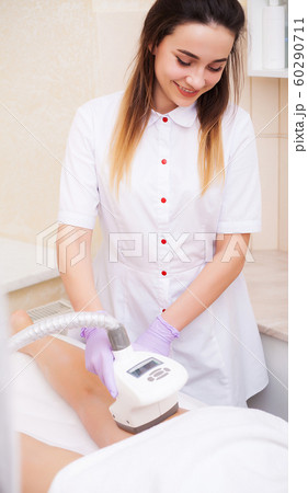 Body Care. Beautician Giving Epilation Laser Treatment To Woman On Leg 60290711