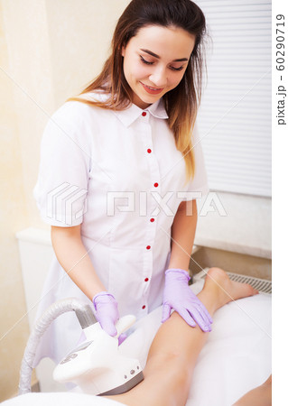 Body Care. Beautician Giving Epilation Laser Treatment To Woman On Leg 60290719