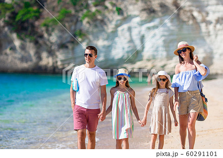 Happy family on the beach during summer vacation 60291101