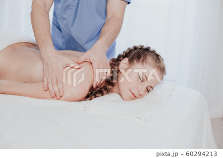 beautiful girl make therapeutic massage in the Spa 60294213