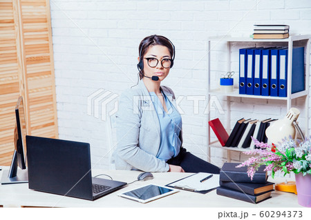 Office callcenter girl works at the computer Office callcenter girl works at the computer 60294373