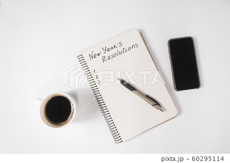 Phrase New Year's Resolutions in the notebook and Phrase New Year's Resolutions in the notebook and 60295114