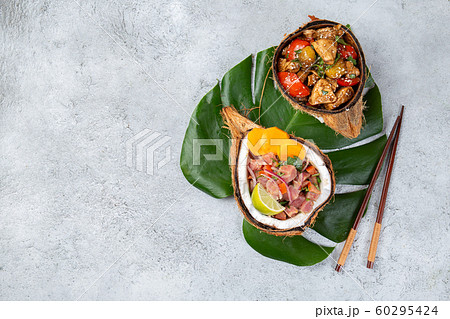 Tahitian Hawaiian dishes Thuna ceviche salad and pineapple chicken with sweet sauce Tahitian Hawaiian dishes Thuna ceviche salad and pineapple chicken with sweet sauce 60295424