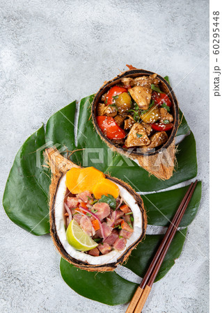 Tahitian Hawaiian dishes Thuna ceviche salad and pineapple chicken with sweet sauce 60295448