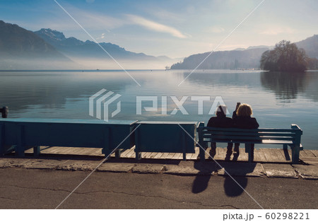 Rear view couple silhouette at in front of Lake Annecy 60298221