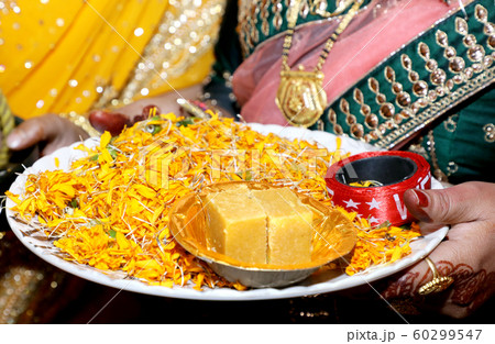 Indian bridesmaid wedding baraat welcome ritual 60299547
