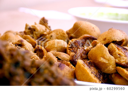 Crispy onion bhajis or kanda or pyaj ke pakore or 60299560