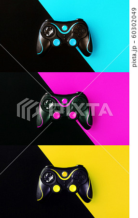 Three Gaming joysticks isolated on a colored 60302049