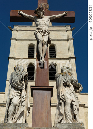 Statue of Jesus Christ at cross in Avignon france Statue of Jesus Christ at cross in Avignon france 60302334