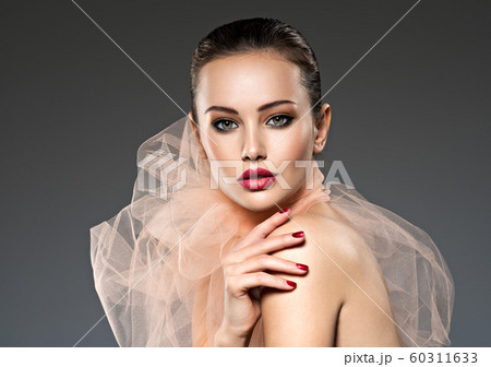 fashion woman with stylish makeup, red nails and 60311633