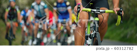 Cycling competition, cyclist athletes riding a race 60312782