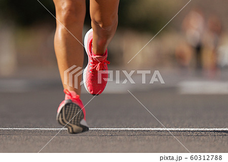 Athlete runner feet running on road close up on shoe , marathon running race 60312788