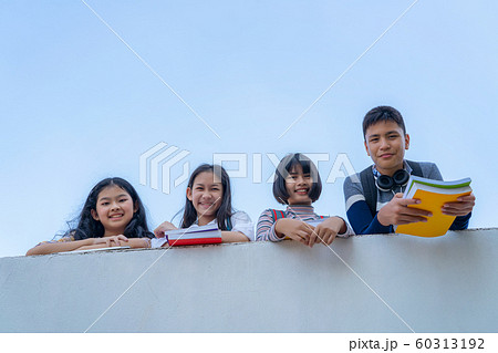Group of students laugh happy standing together 60313192