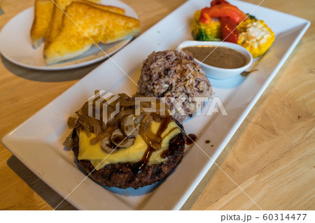 Chopped teriyaki steak with cheese and onion 60314477
