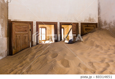 Abandoned and forgotten building and room left by people and being taken over by encroaching sandstorm, Kolmanskop ghost town, Namib Desert Abandoned and forgotten building and room left by people and being taken over by encroaching sandstorm, Kolmanskop ghost town, Namib Desert 60314651