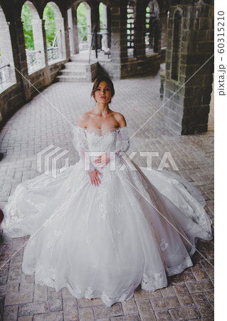 Seductive young bride posing on the territory of country hotel 60315210