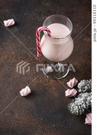 Pink Christmas cocktail with marshmallow 60316310