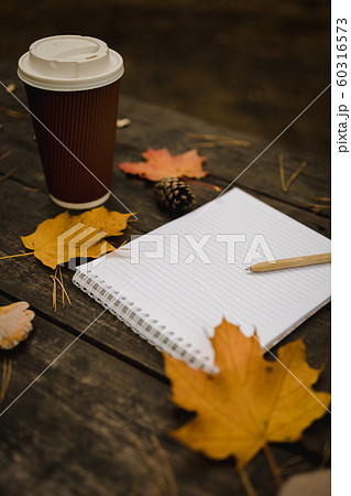 White blank notebook and pen on a dark background 60316573