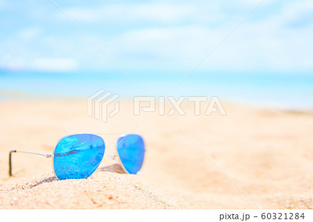 Sunglasses on the beach. 60321284