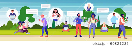 people using chatting apps on digital devices social network speech chat bubble communication concept mix race men women relaxing in park horizontal full length people using chatting apps on digital devices social network speech chat bubble communication concept mix race men women relaxing in park horizontal full length 60321285