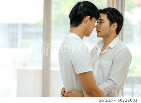 Asian Gay Couple With White Shirt Touch Their の写真素材