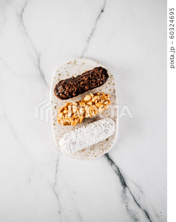 Healthy eclairs or profitroles on marble background 60324695