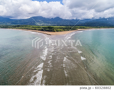 Aerial view National Park Punta Uvita Beautiful beach tropical forest pacific coast Costa Rica shape whale tail Aerial view National Park Punta Uvita Beautiful beach tropical forest pacific coast Costa Rica shape whale tail 60328802