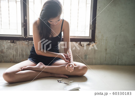 Addicted sexy woman  inject heroin drug in house 60330183
