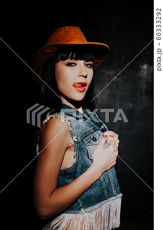 beautiful sexy girl in cowboy hat and denim 60333292