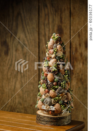 Decorative christmas tree on wooden background Decorative christmas tree on wooden background 60336177