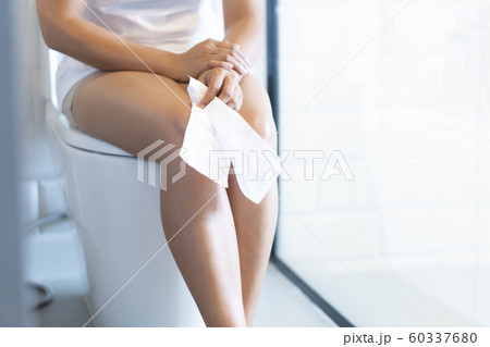 Close up woman stomachache with toilet Close up woman stomachache with toilet 60337680