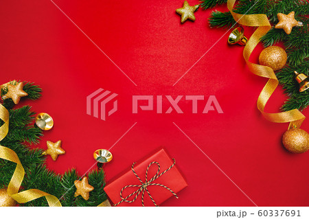 Christmas present and pine tree with xmas decoration on Red background 60337691