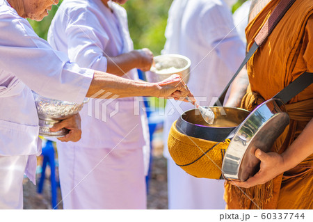The monks of the Buddhist Sangha(give alms to a 60337744