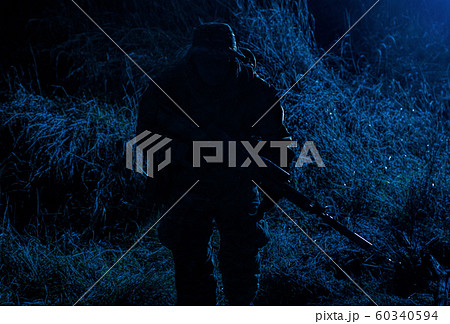 Infantry shooting with sniper rifle in darkness 60340594