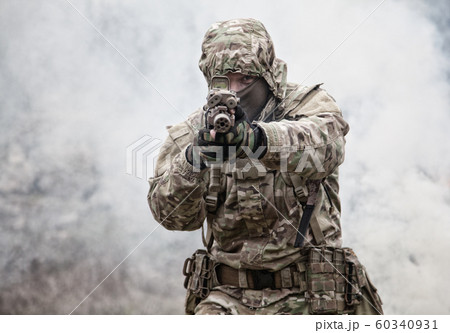 army soldier attacking enemies trough smoke screen army soldier attacking enemies trough smoke screen 60340931