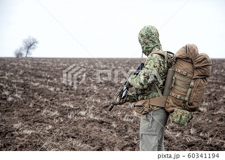 Portrait of modern army infantryman on march 60341194