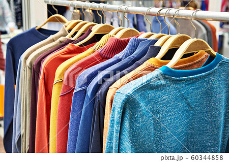 Sweaters on hanger in store Sweaters on hanger in store 60344858