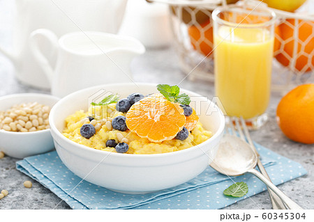 Corn porridge with fresh blueberry, orange and Corn porridge with fresh blueberry, orange and 60345304