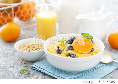 Corn porridge with fresh blueberry, orange and Corn porridge with fresh blueberry, orange and 60345305