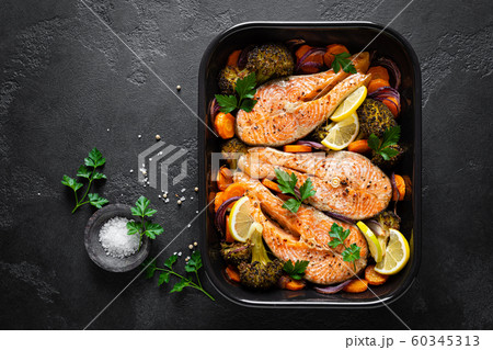 Salmon. Baked salmon fish steaks with vegetables, 60345313