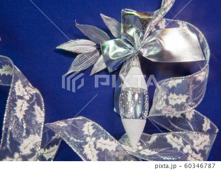 glass icicle New Year's balls on a blue background glass icicle New Year's balls on a blue background 60346787