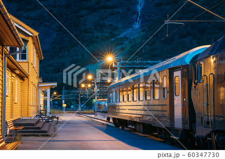 Flam, Norway. Famous Railroad Flamsbahn. Green Norwegian Train Near Railway Station Flam, Norway. Famous Railroad Flamsbahn. Green Norwegian Train Near Railway Station 60347730