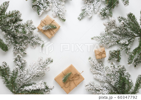 Fur spruce pine coniferous branches, toys and gift box isolated on white background. 60347792