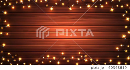 Christmas lights. Garlands on wooden background 60348619