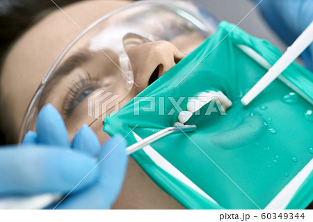 Pretty woman's teeth treatment in dental clinic 60349344