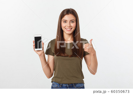 Girl Holding Smart Phone - Beautiful smiling girl holding a smart phone 60350673