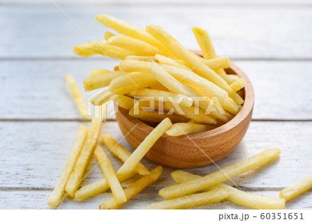 Fresh french fries in wooden bowl delicious Fresh french fries in wooden bowl delicious 60351651