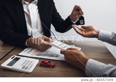 New car buyers and car sales agent people are 60357349